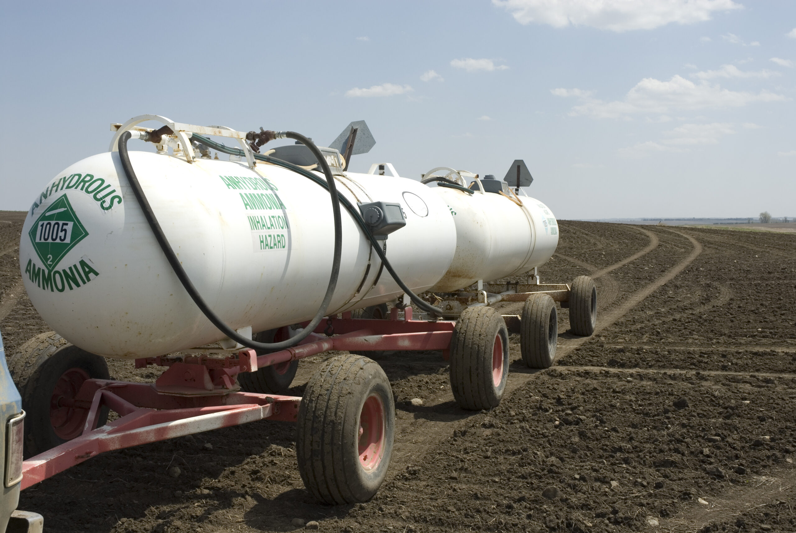 Anhydrous Ammonia tanks in newly planted wheat field